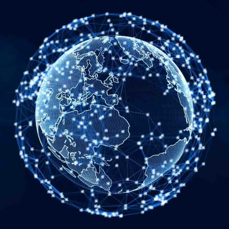 Digital representation of Earth with interconnected network nodes glowing on a dark blue background, illustrating global connectivity.