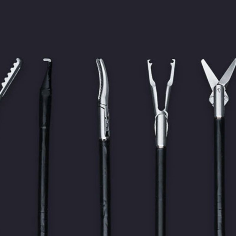 Five different types of medical forceps arranged vertically against a dark grey background.