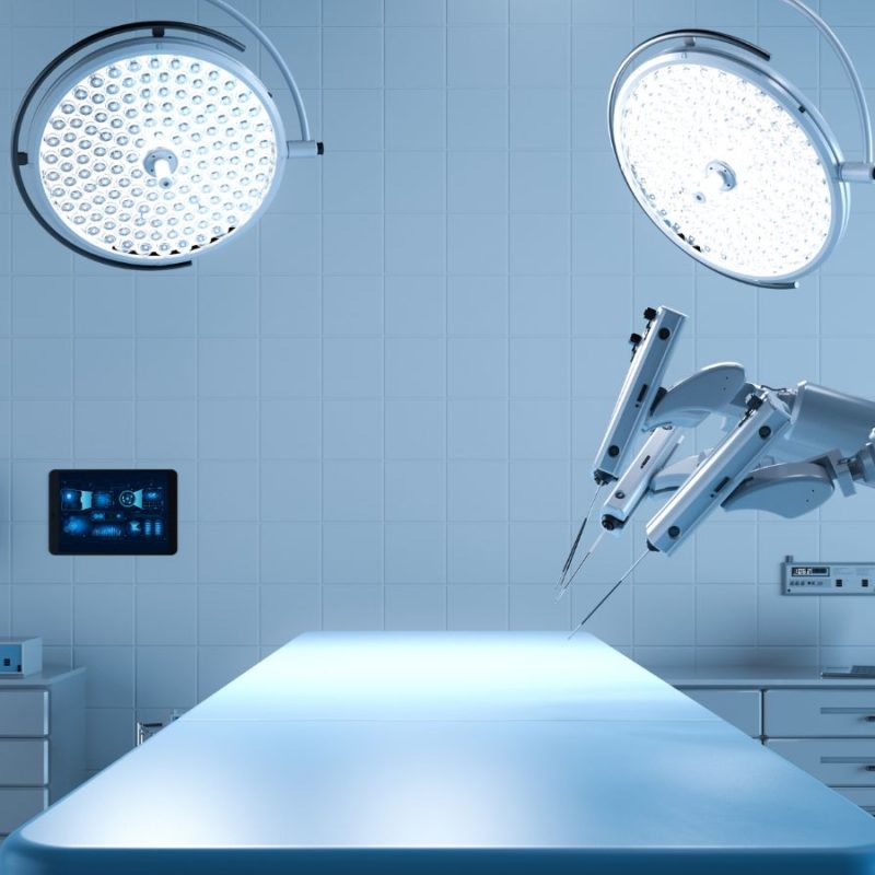 A modern, sterile surgical room equipped with advanced robotic surgery tools, bright overhead lights, and digital monitors displaying data.