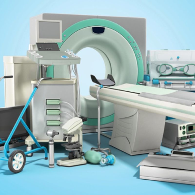 A collection of medical equipment including an MRI machine, ultrasound device, incubator, hospital bed, and other diagnostic tools arranged against a light blue background.