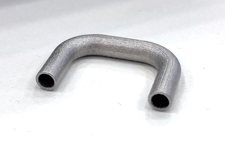 Metal pipe bent into a u-shape, displayed on a plain white background.