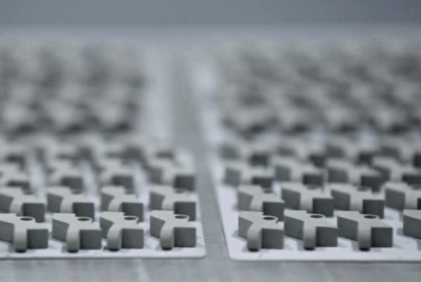Close-up of mechanical keyboard switches in rows, focused on foreground with a blurred background.