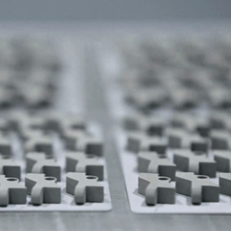 Close-up of mechanical keyboard switches in rows, focused on foreground with a blurred background.