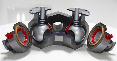 A display of four industrial ball valves connected in pairs with visible red seals and steel levers, created using a 3D metal printer, against a white background.