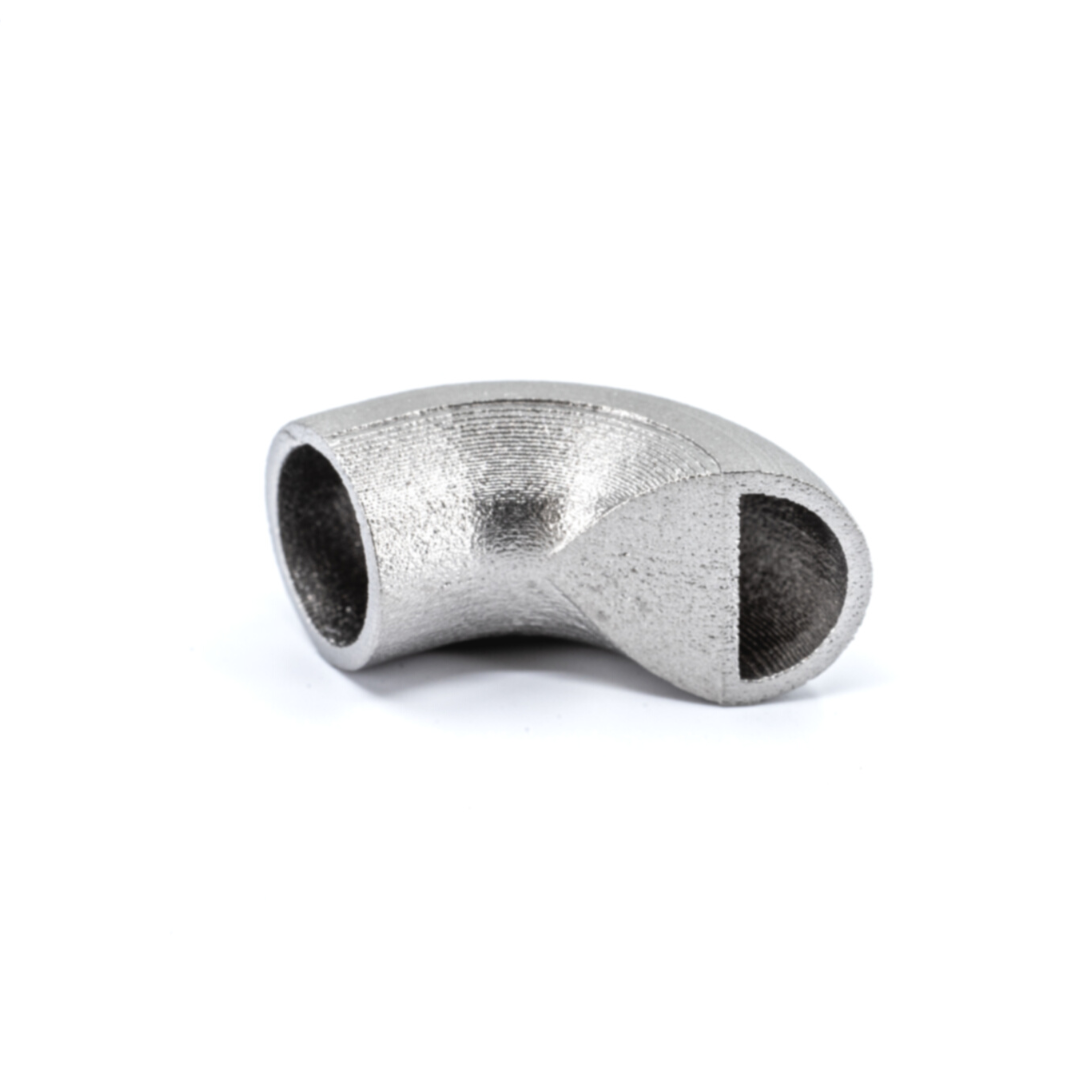 3D printing case studies of a metal pipe fitting with a y-shaped junction on a white background.