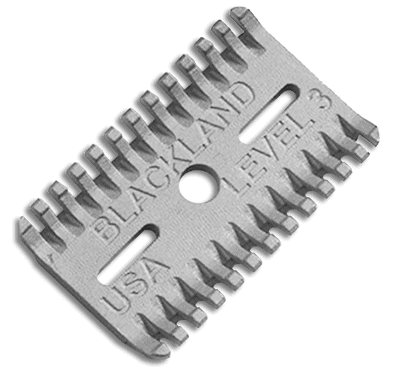 A metal razor blade with an open comb base plate and the text "BLACKLAND LEVEL 3 USA" engraved on it. The blade boasts a series of small teeth along both edges.